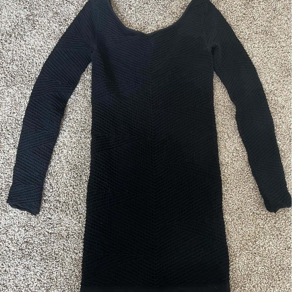 Black bodycon long sleeved BCBG generation dress.